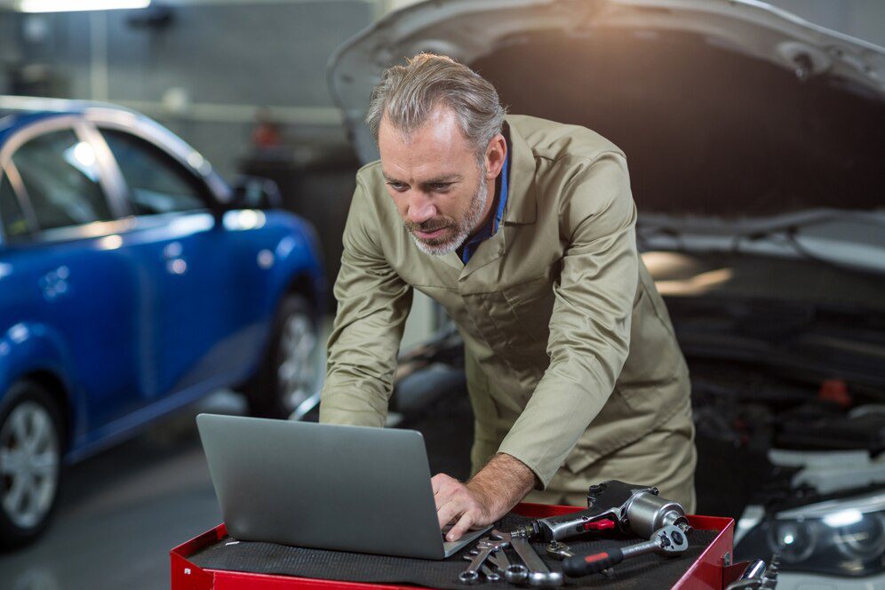 Mechanic Diagnosing Car Engine