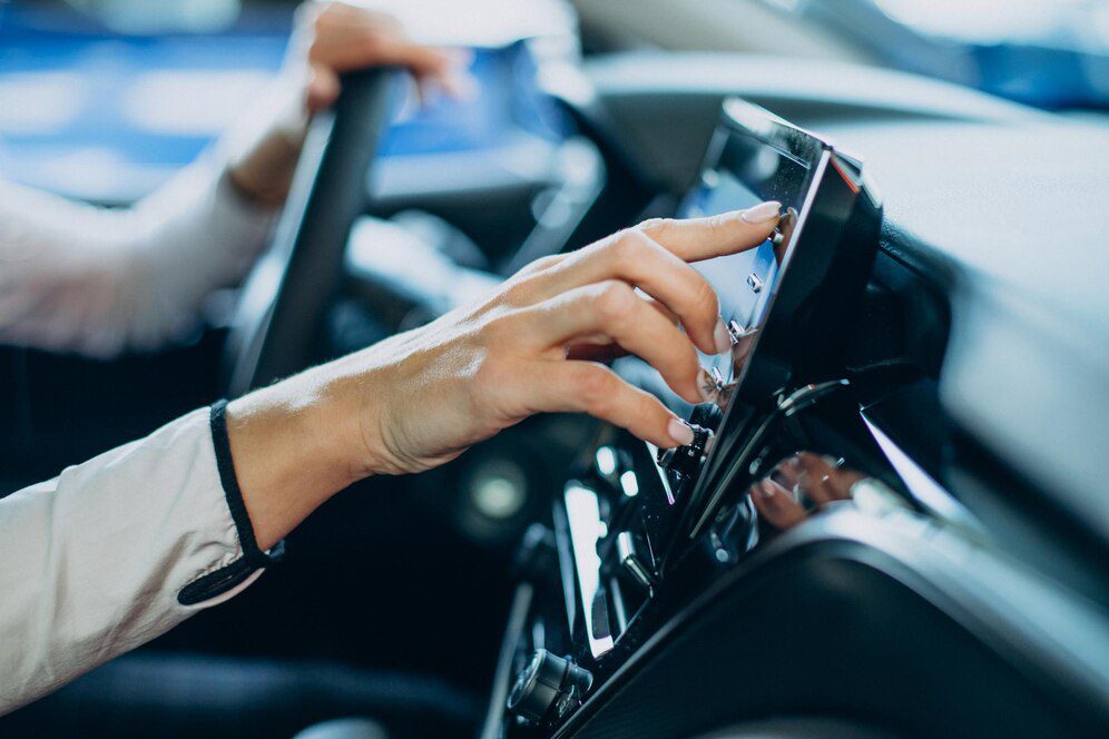 Driver adjusting car touch screen